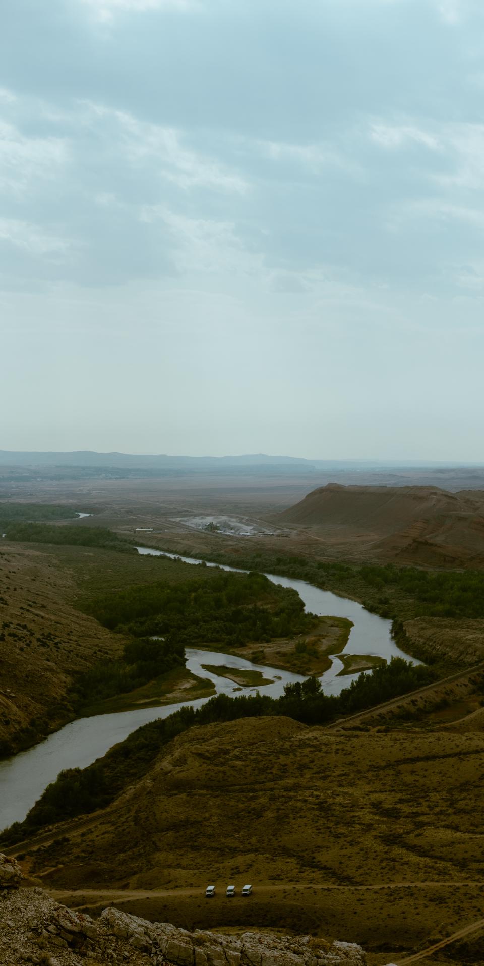 A photo of the Bighorn River as it cuts through Sheep Mountain. The photographer is looking down from a ridge on the mountain.