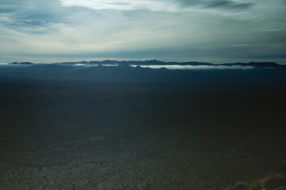 Low clouds in a nearby mountain range.